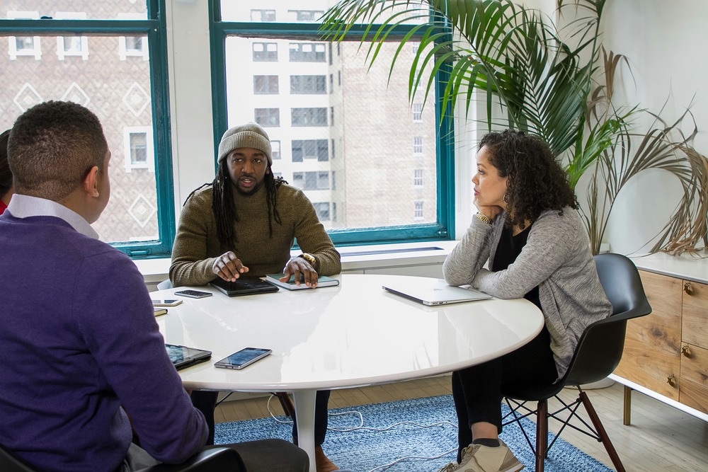 three people in an interview