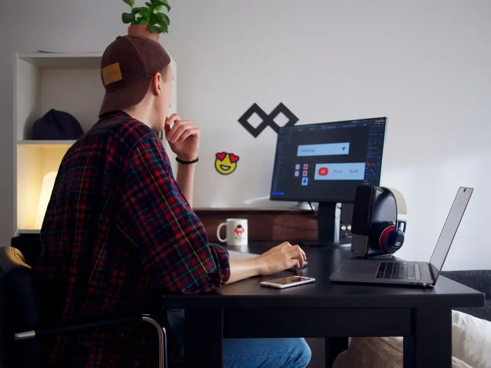 a marketer working on his laptop